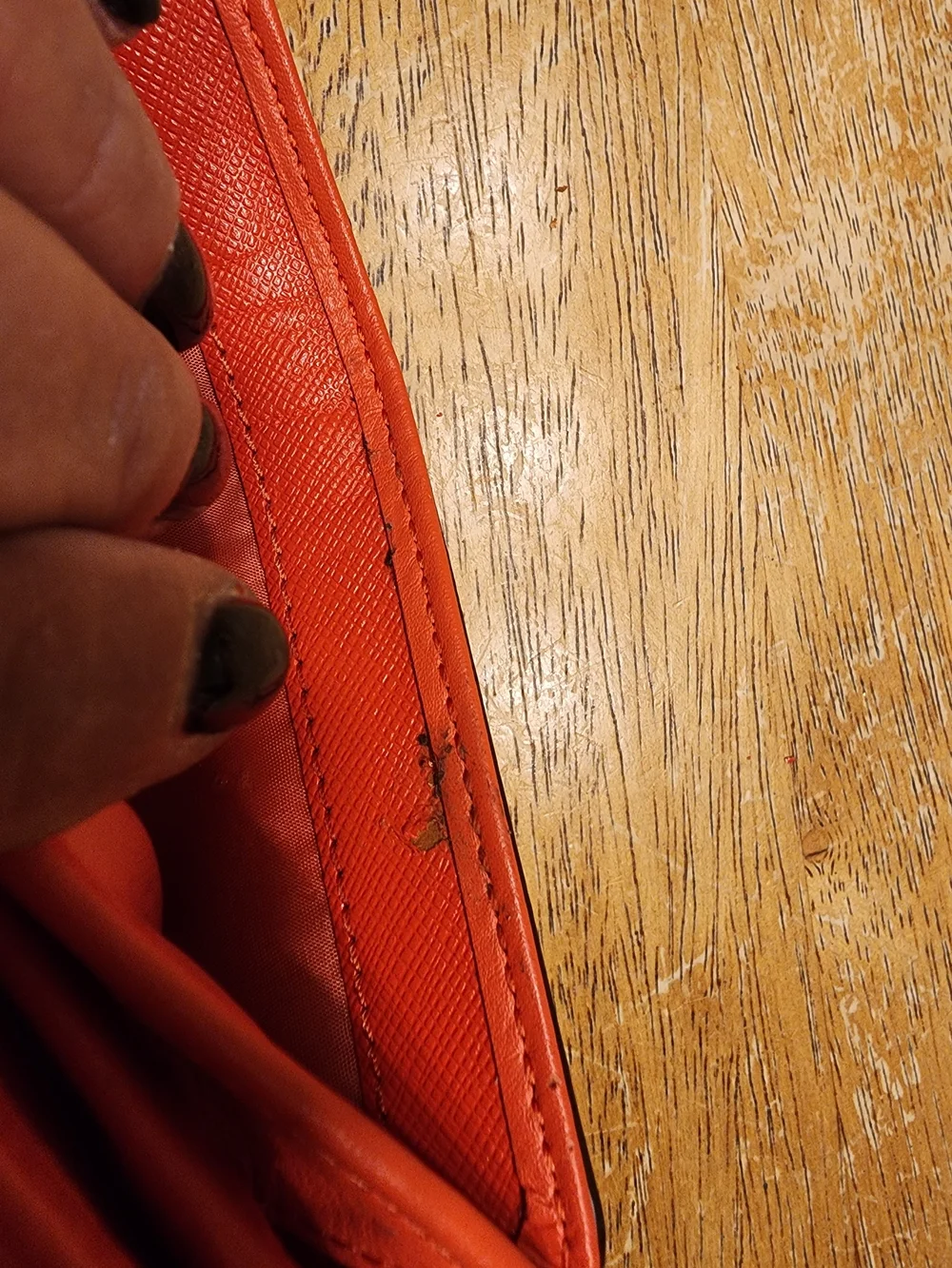 Coach Campbell Leather Buckle Medium Wallet in a vibrant orange shade with brass